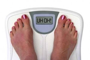 feet on a bathroom scale - isolated